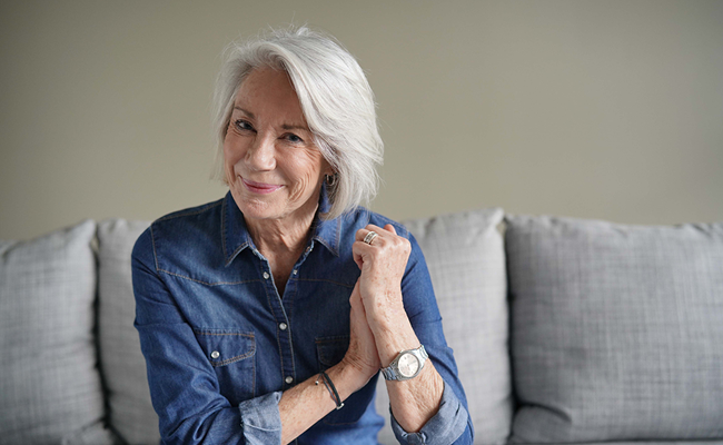 Woman smiling on couch