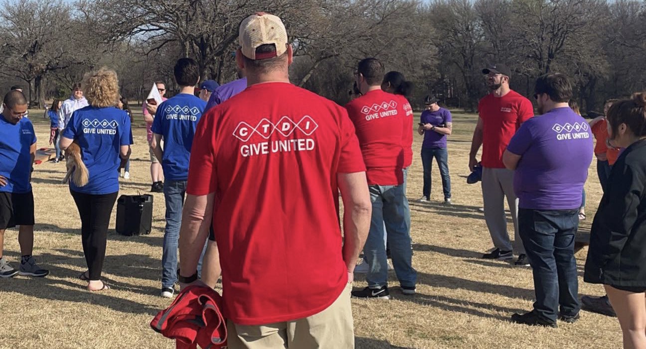 CTDI employee with GIVE UNITED T-shirt