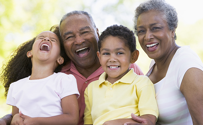 Grandparents laughing with grandkids