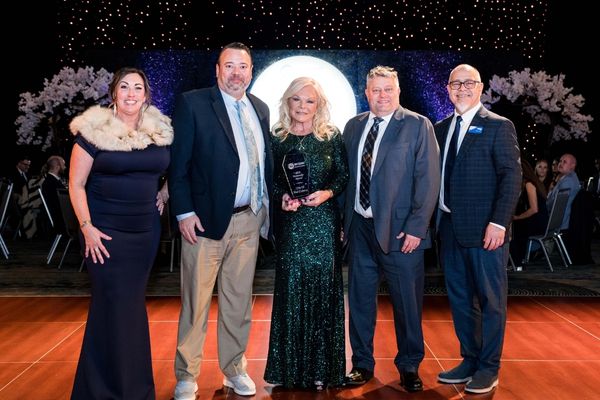 Representatives from the city of They Colony accept their award.