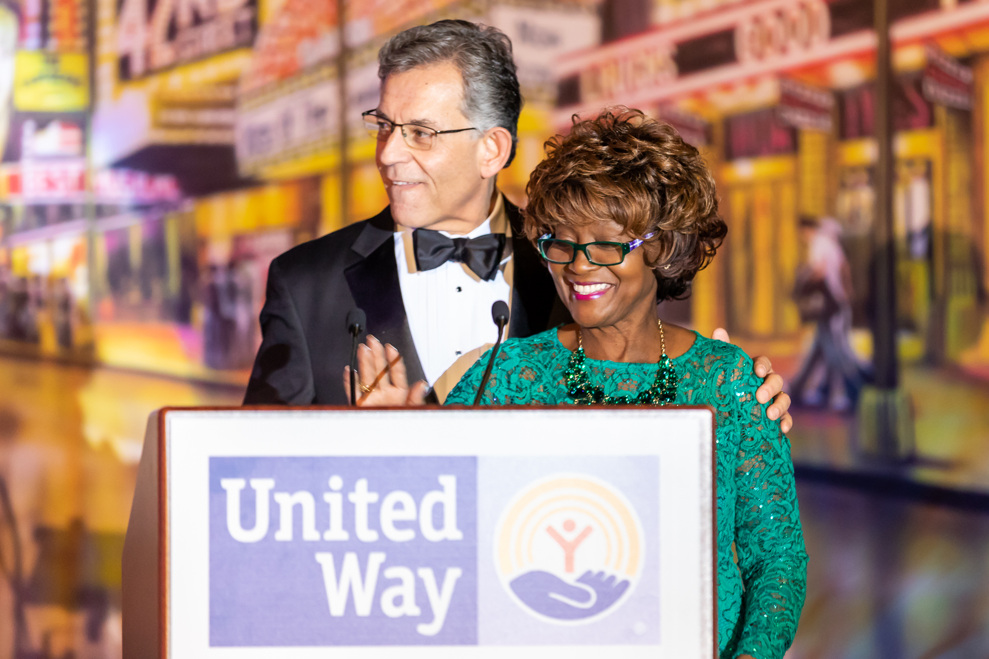 Bobbie Mitchell accepting award from Gary Henderson