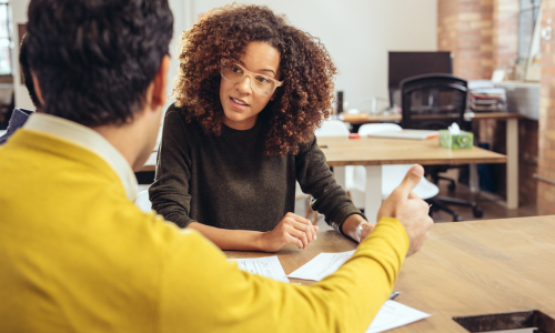 volunteer helping someone with taxes