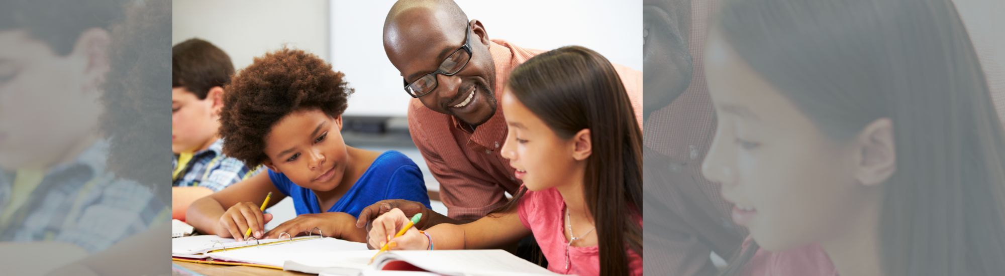 Teacher helping students