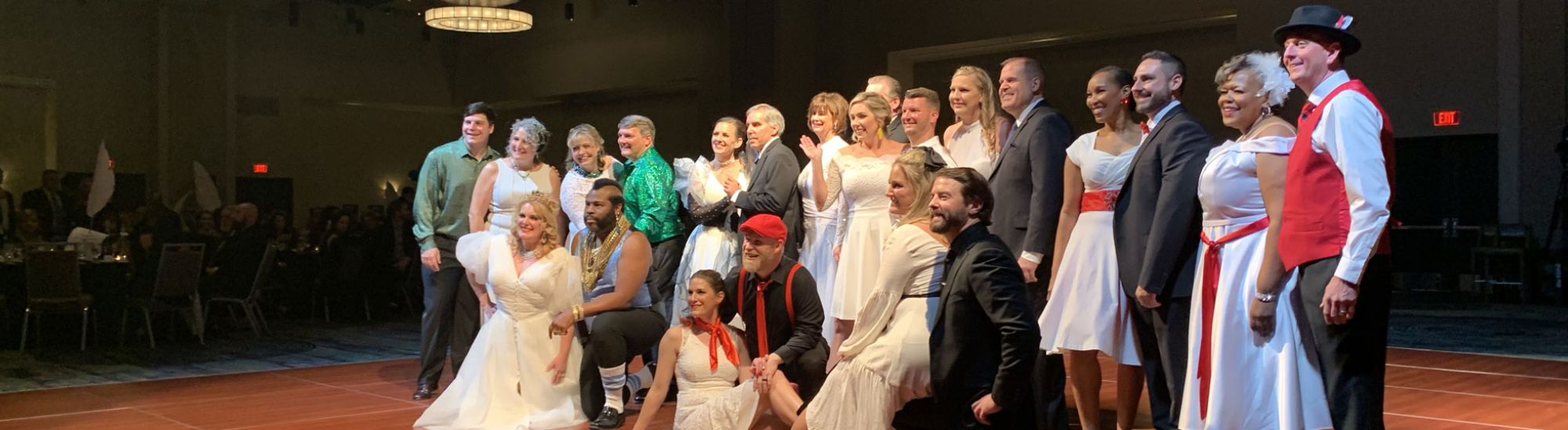 Dancing with Our Stars contestants gather on dance floor for group photo