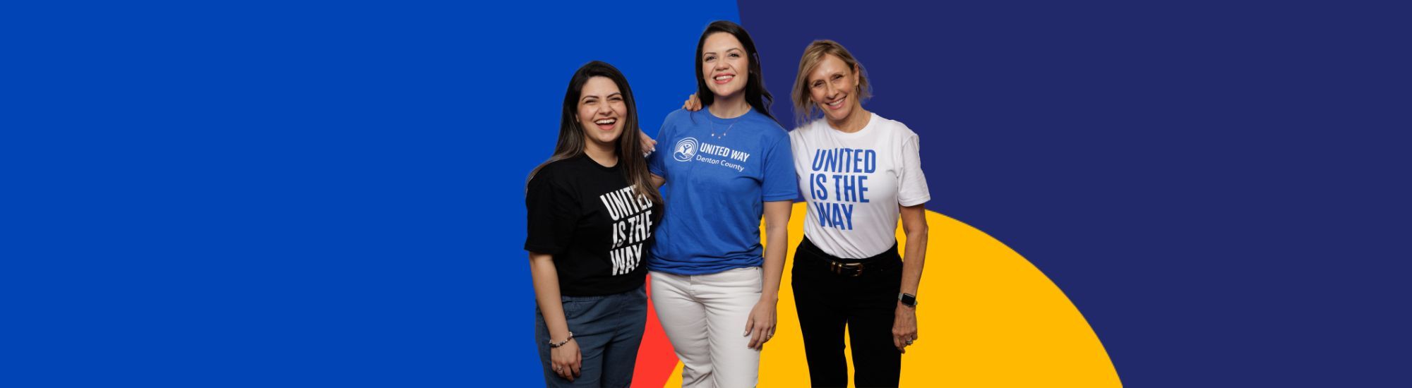 Three women wearing United is the Way tshirts